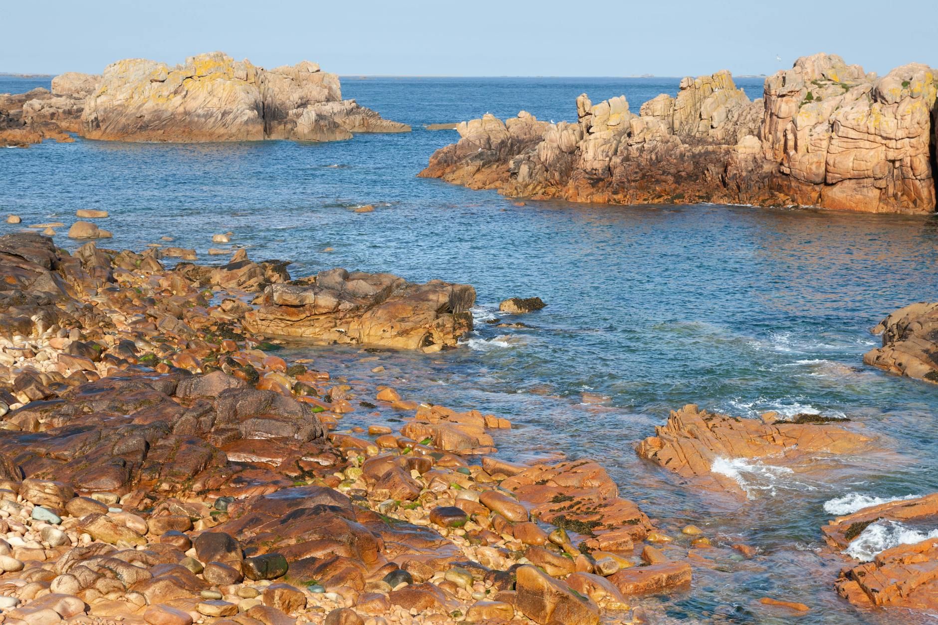 Scenic view of rocky coastline on Île-de-Bréhat, Brittany, France during summer.
